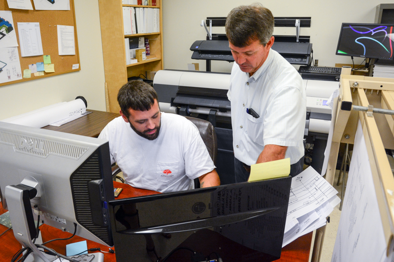 Bradley Plumbing and heating staff reviewing job plans