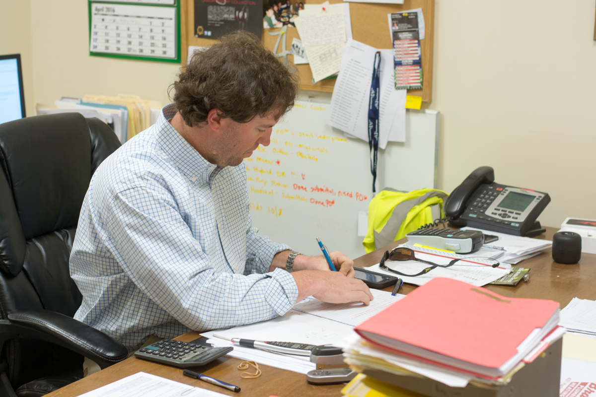 Bradley plumbing and heating staff reviewing plans